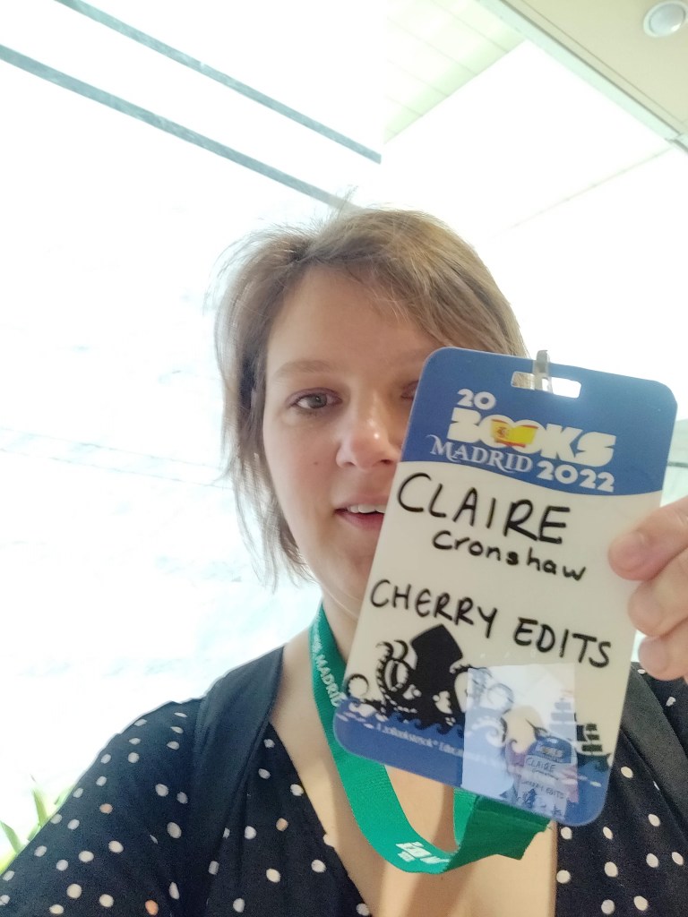 Photo of Claire Cronshaw with lanyard for 20 Books Madrid 2022